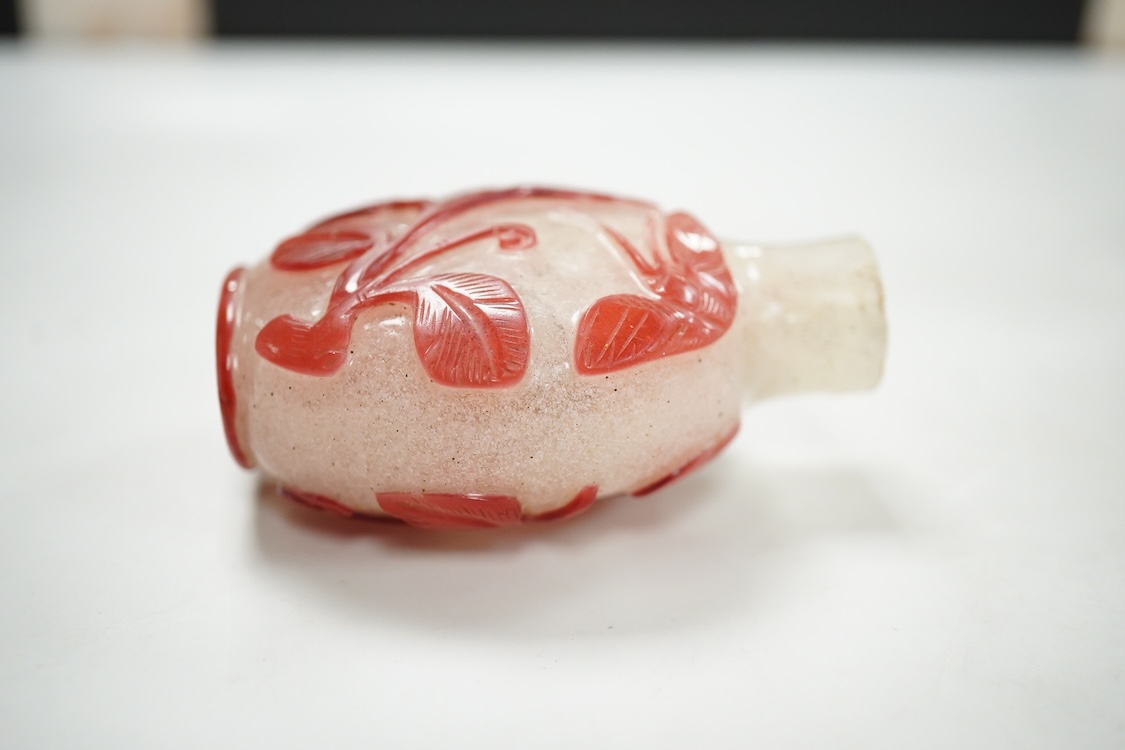 A Chinese cinnabar lacquer snuff bottle, a glass overlay snuff bottle and an underglaze copper red snuff bottle-9cm high (3)
